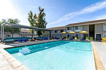 Two swimming pools with lounge seating